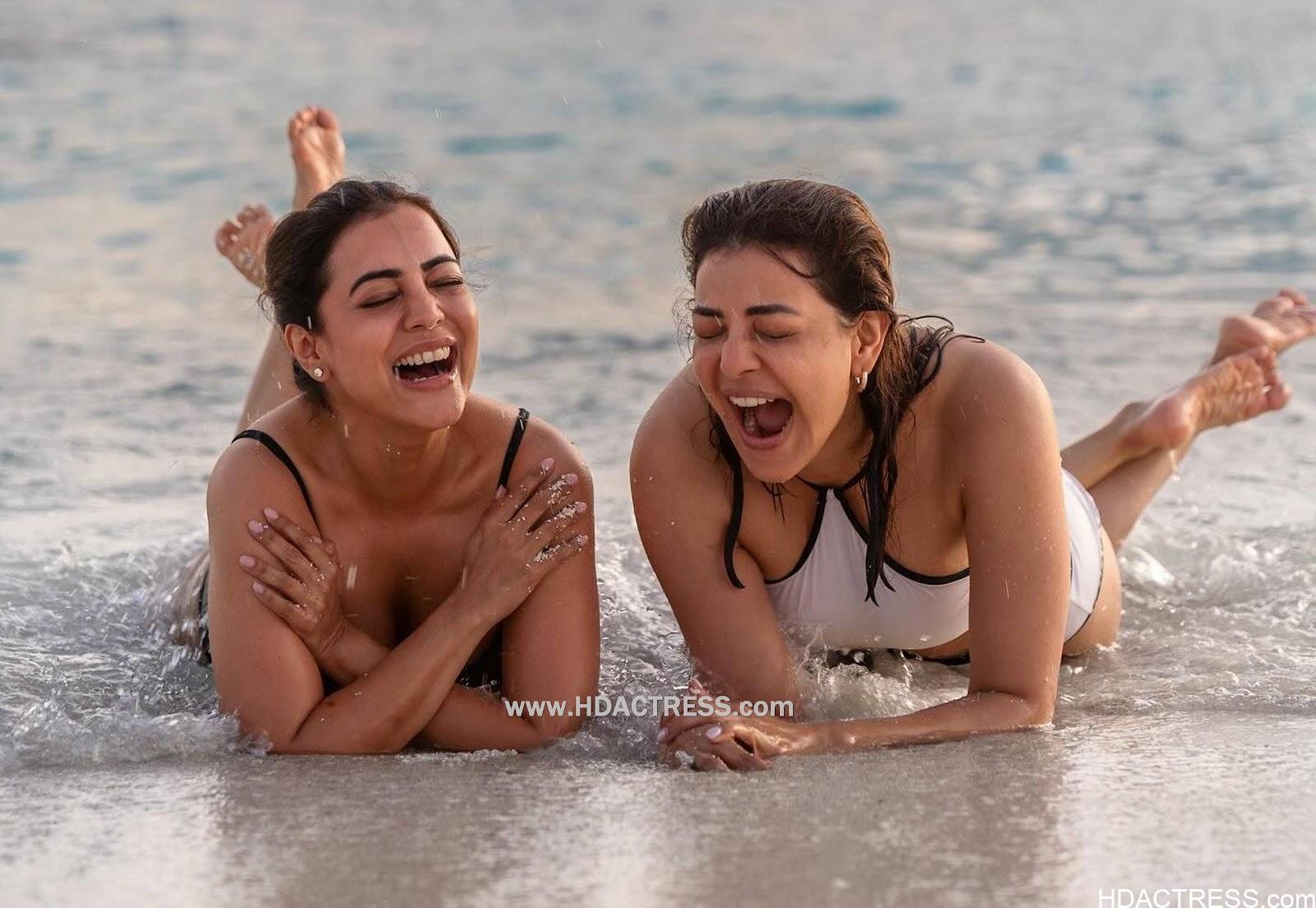 Kajal Aggarwal & Nisha Aggarwal Flaunt Their Curves in Bikini Sensational Swimwear - Image 1