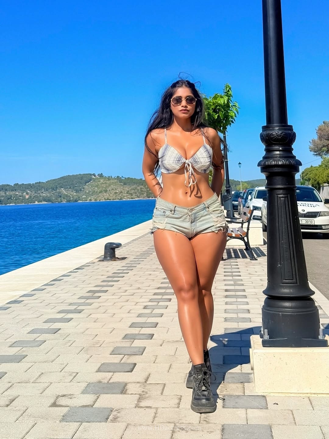 Pratika sood turns heads in front-tie halter top with denim shorts.. - Image 2 Pratika sood turns heads in front-tie halter top with denim shorts.. - Image 2