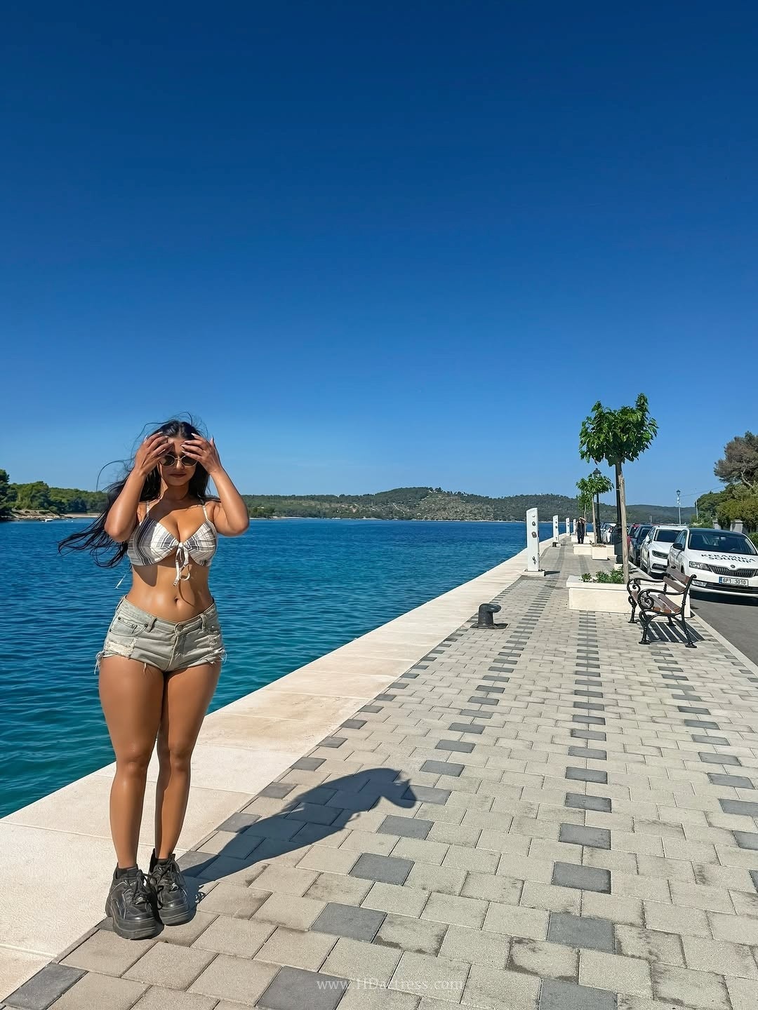 Pratika sood turns heads in front-tie halter top with denim shorts.. - Image 8 Pratika sood turns heads in front-tie halter top with denim shorts.. - Image 8