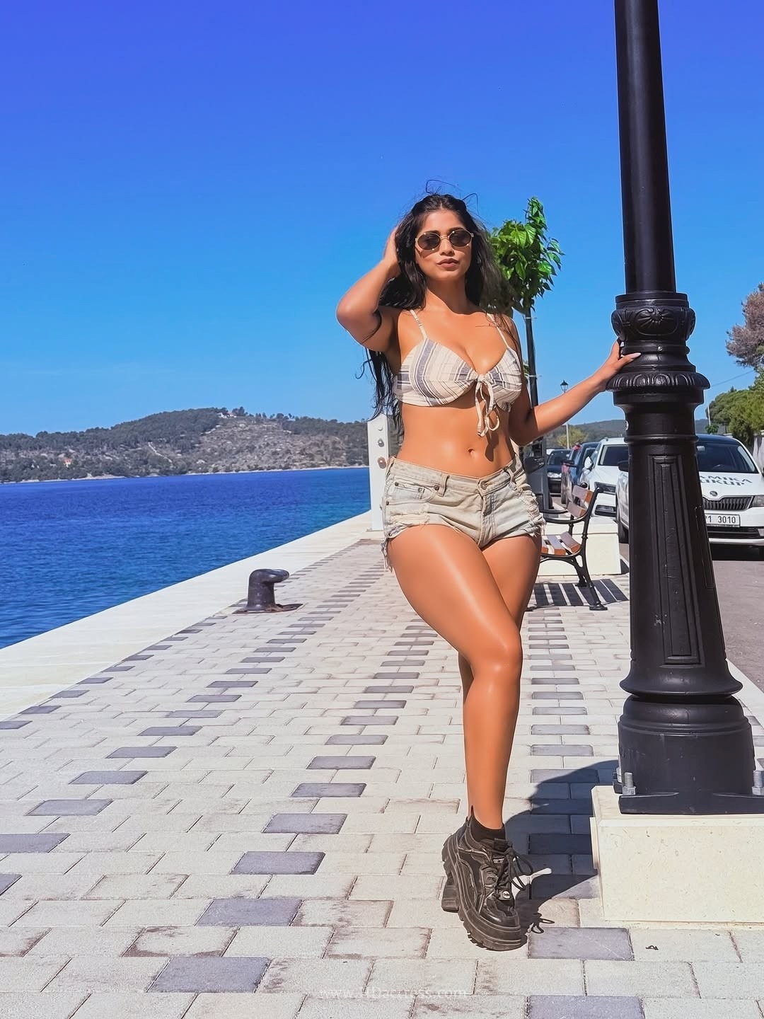 Pratika sood turns heads in front-tie halter top with denim shorts.. - Image 11 Pratika sood turns heads in front-tie halter top with denim shorts.. - Image 11