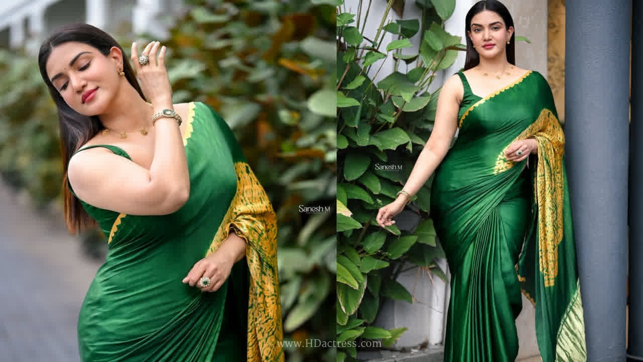 Honey rose flaunts her stunning curves in an elegant emerald green silk saree