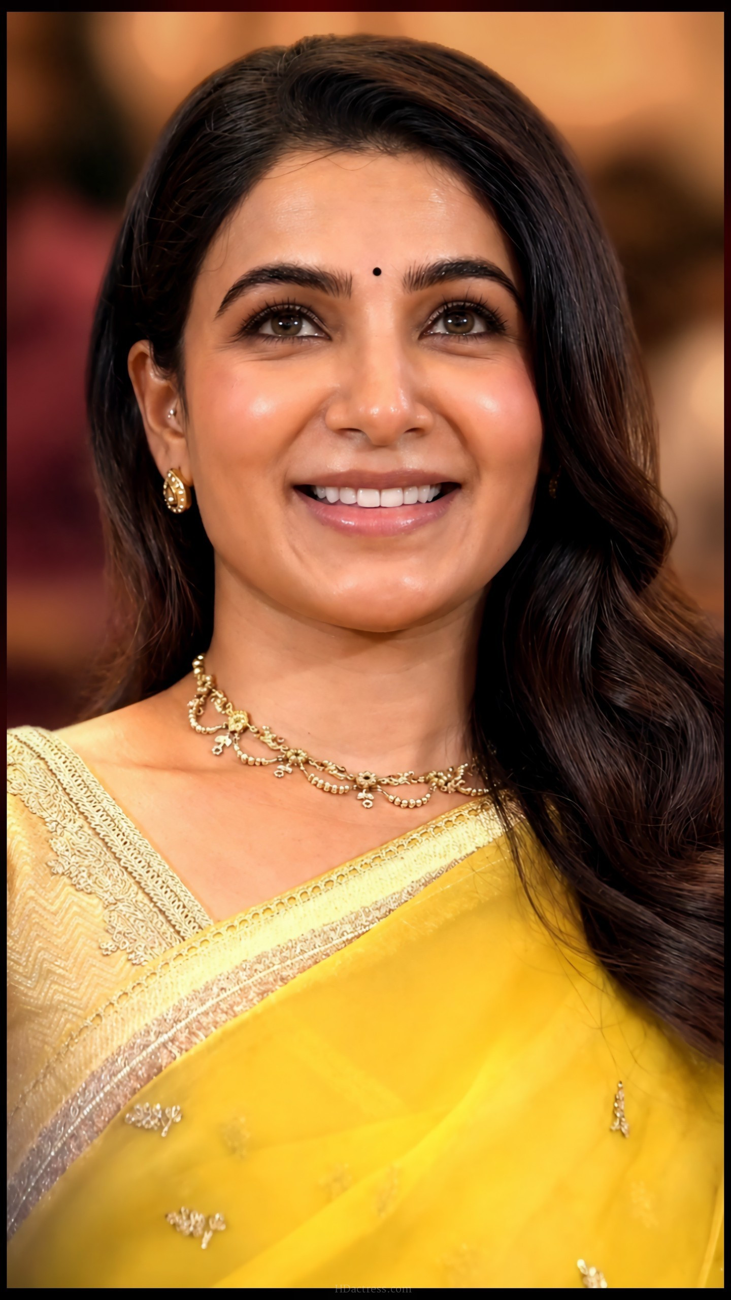 Glance of Samantha looking directly into the camera lens with a powerful sultry expression during a high-fashion shoot