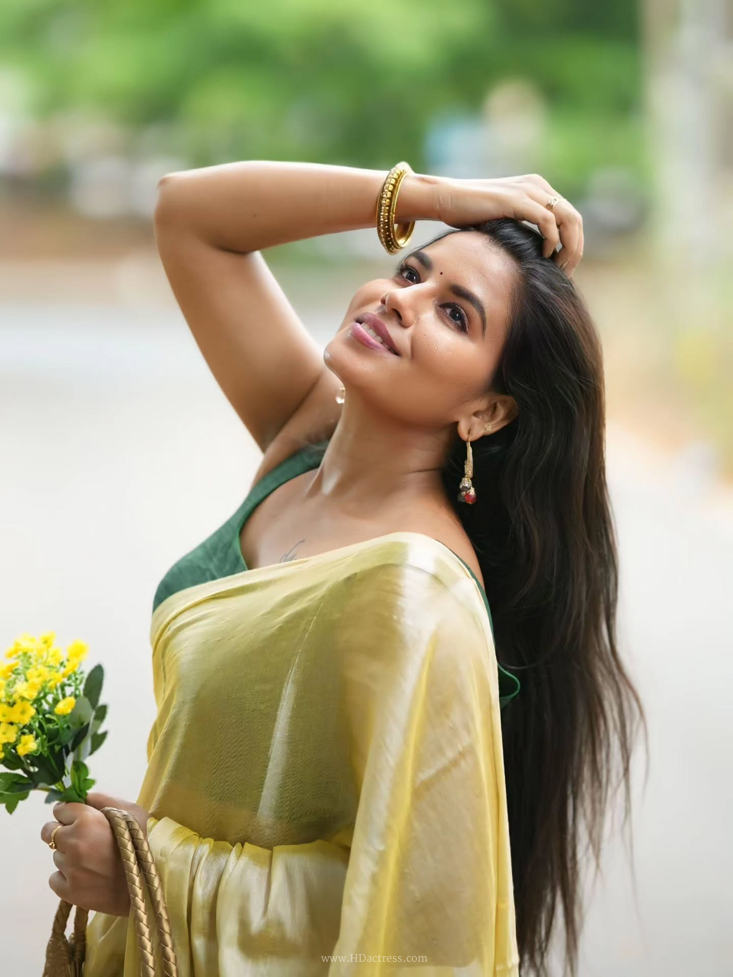 Chitra Rebecca in pale yellow metallic silk saree