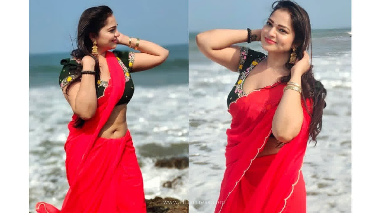 Ashwini sri looks gorgeous in beach side red saree photos..