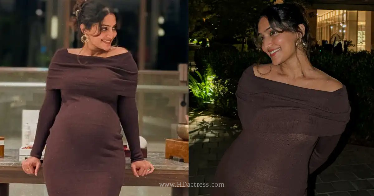 South actress Reba Monica John in a flowing orange outfit flaunting her pregnant baby bump by a beachfront pool in Phuket.  