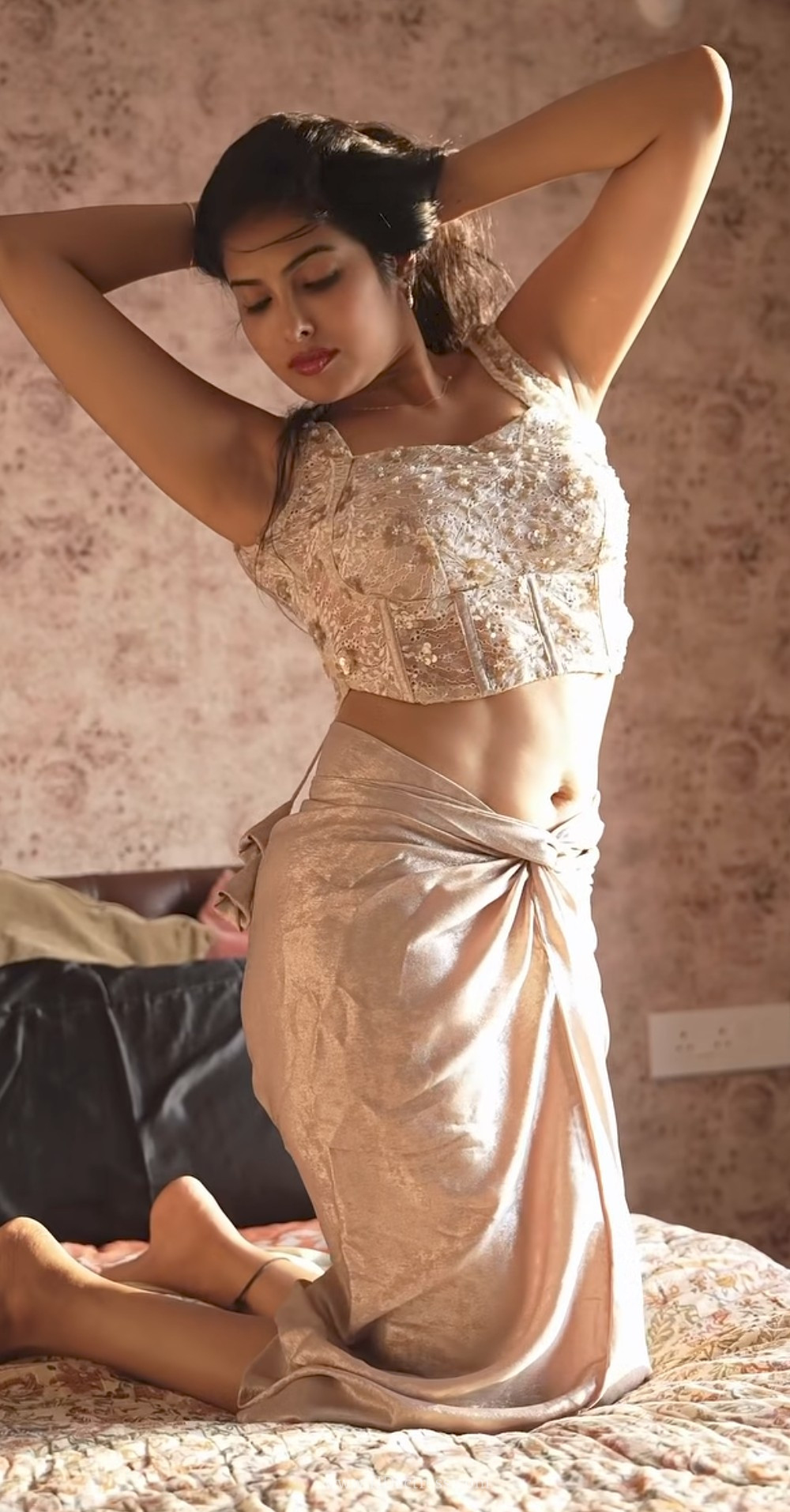Where can I find the latest viral photoshoot of Divi Vadthya on the bed?