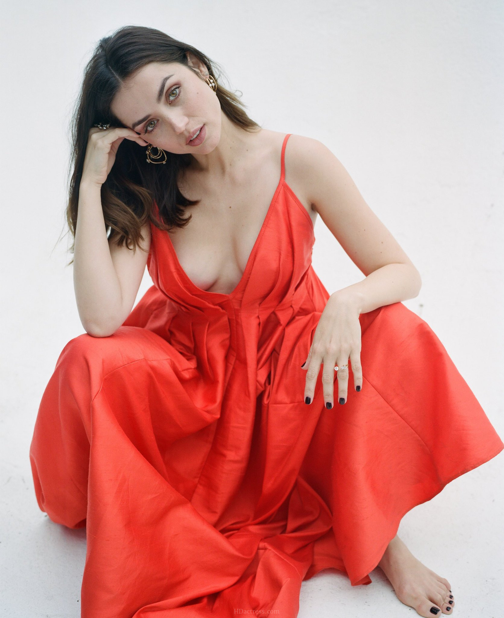 Full-length candid photo of Ana de Armas looking classy and bold while wearing a sophisticated designer outfit.