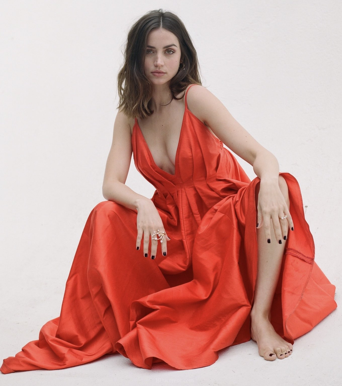Close-up portrait of 37-year-old actress Ana de Armas showcasing her classy and bold features in soft studio lighting.