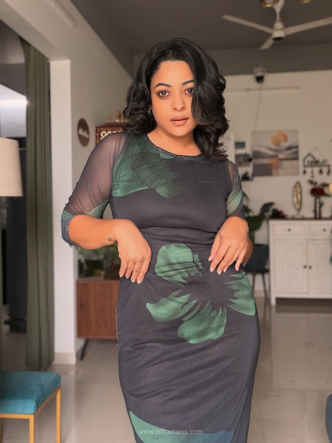 Anjali Rao looking stunning in a sheer black mesh long-sleeve dress posing for a viral fashion photoshoot.