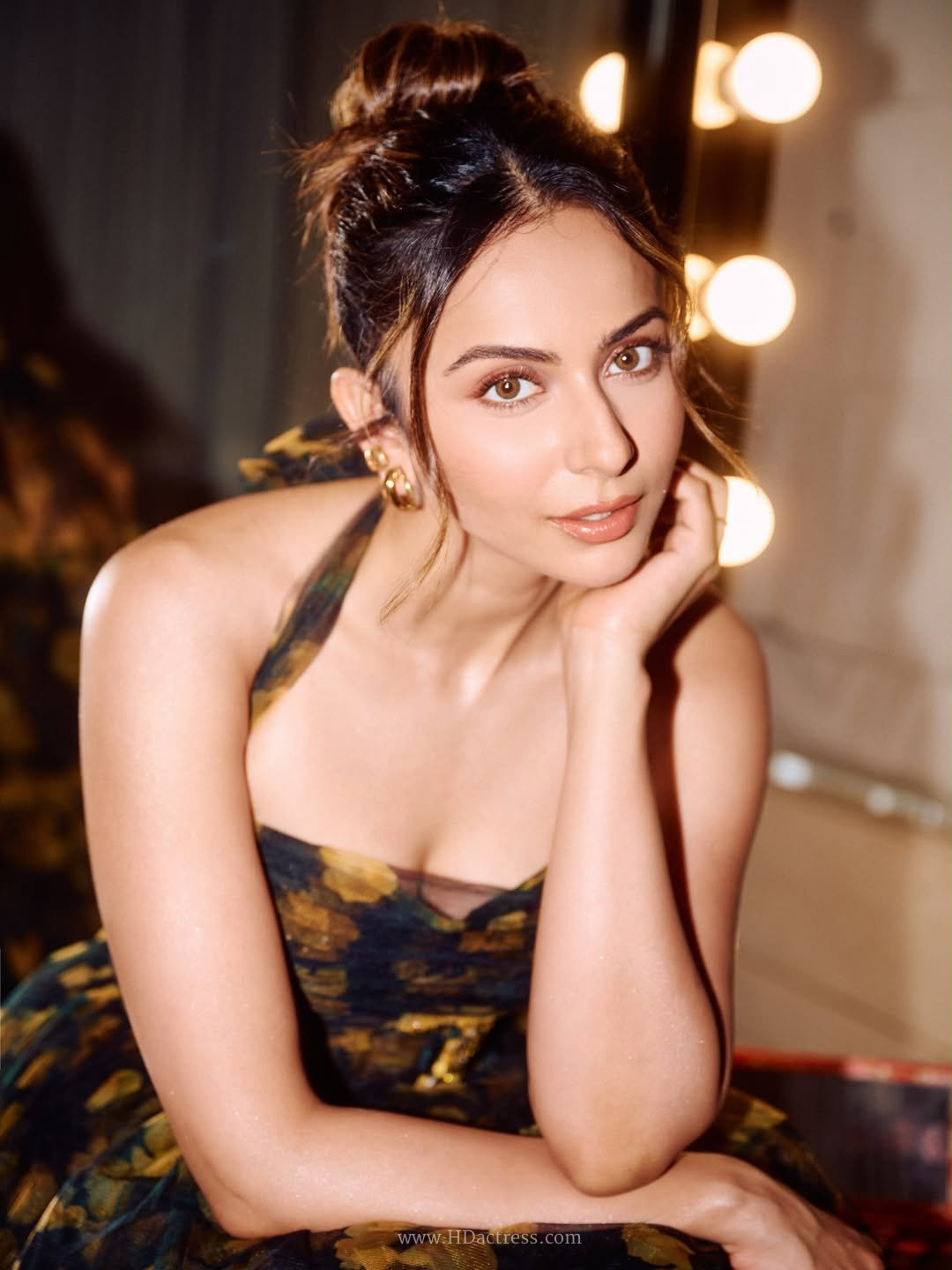 Full-length portrait of actress Rakul Preet Singh styling a designer plunging neckline maxi dress.