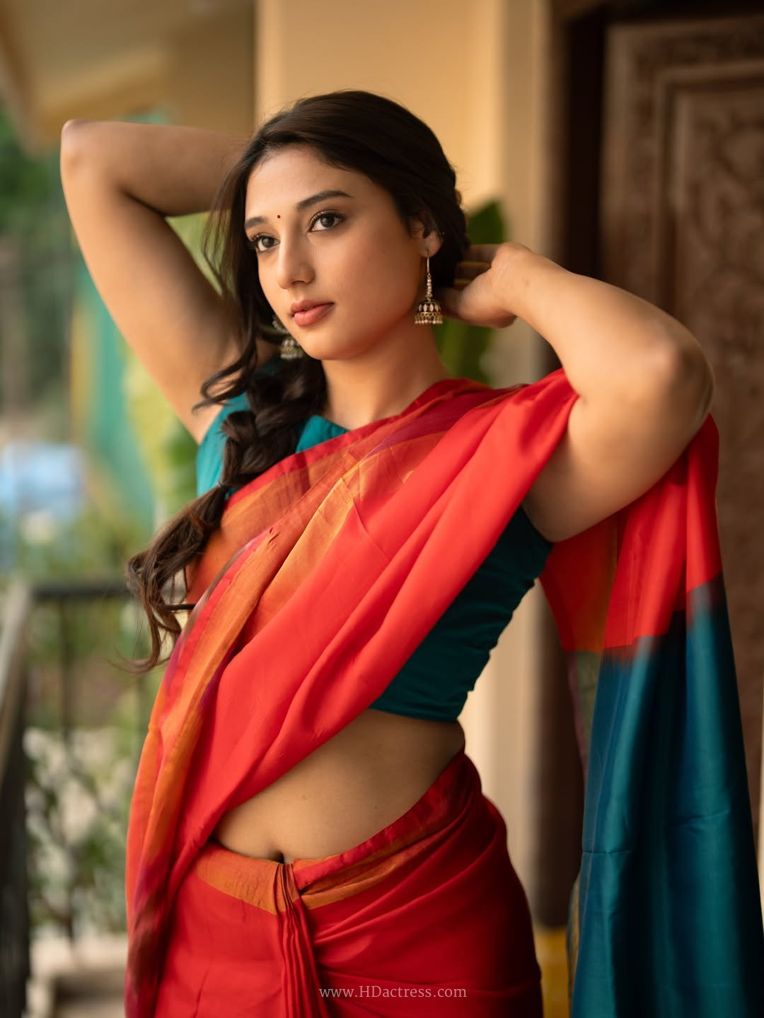 Ritika Nayak looking stunning and elegant in a beautiful red designer saree during a recent photoshoot.