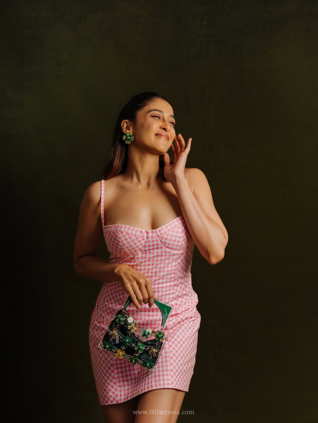 Regina Cassandra Flaunts Flawless Curves in Viral Corset Dress & High Boots
