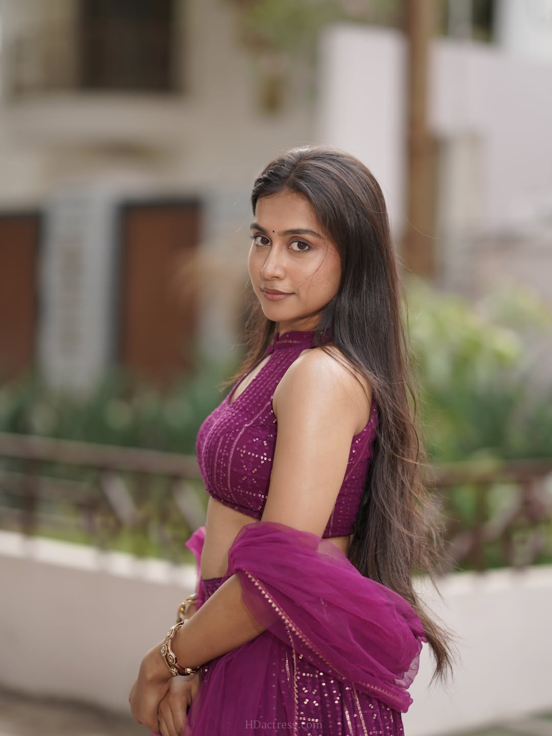 Kruthika Umashankar in magenta lehenga choli with net dupatta Kruthika Umashankar in magenta lehenga choli with net dupatta