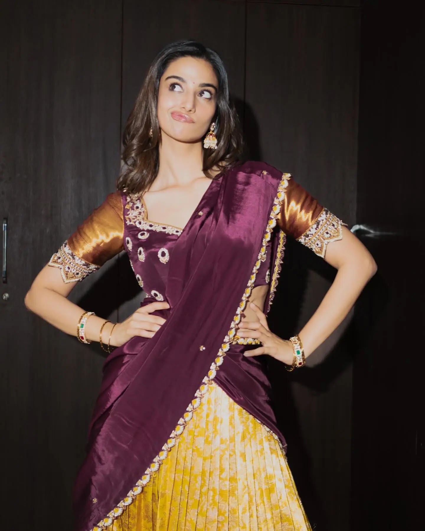 Meenakshi Chaudhary Stills In Jewellery Yellow Lehenga Choli