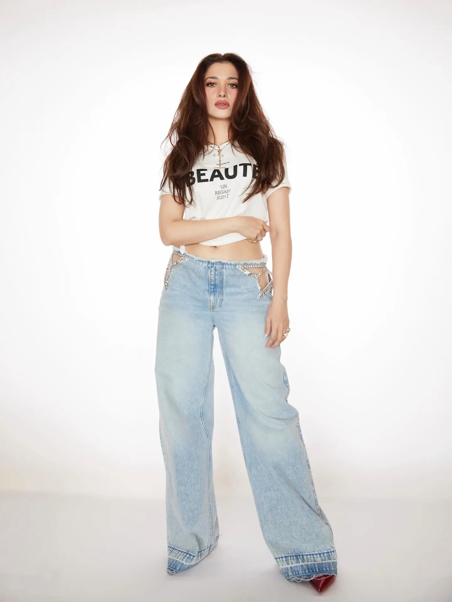 Beautiful Indian Actress Tamannaah Bhatia Stills In White Top Blue Jeans - Image 1