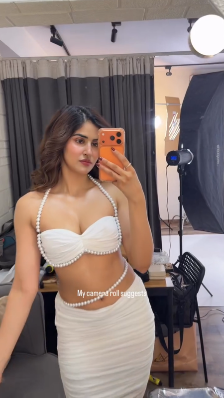 Sakshi Malik posing confidently in a revealing and sexy designer outfit, showcasing her toned physique.