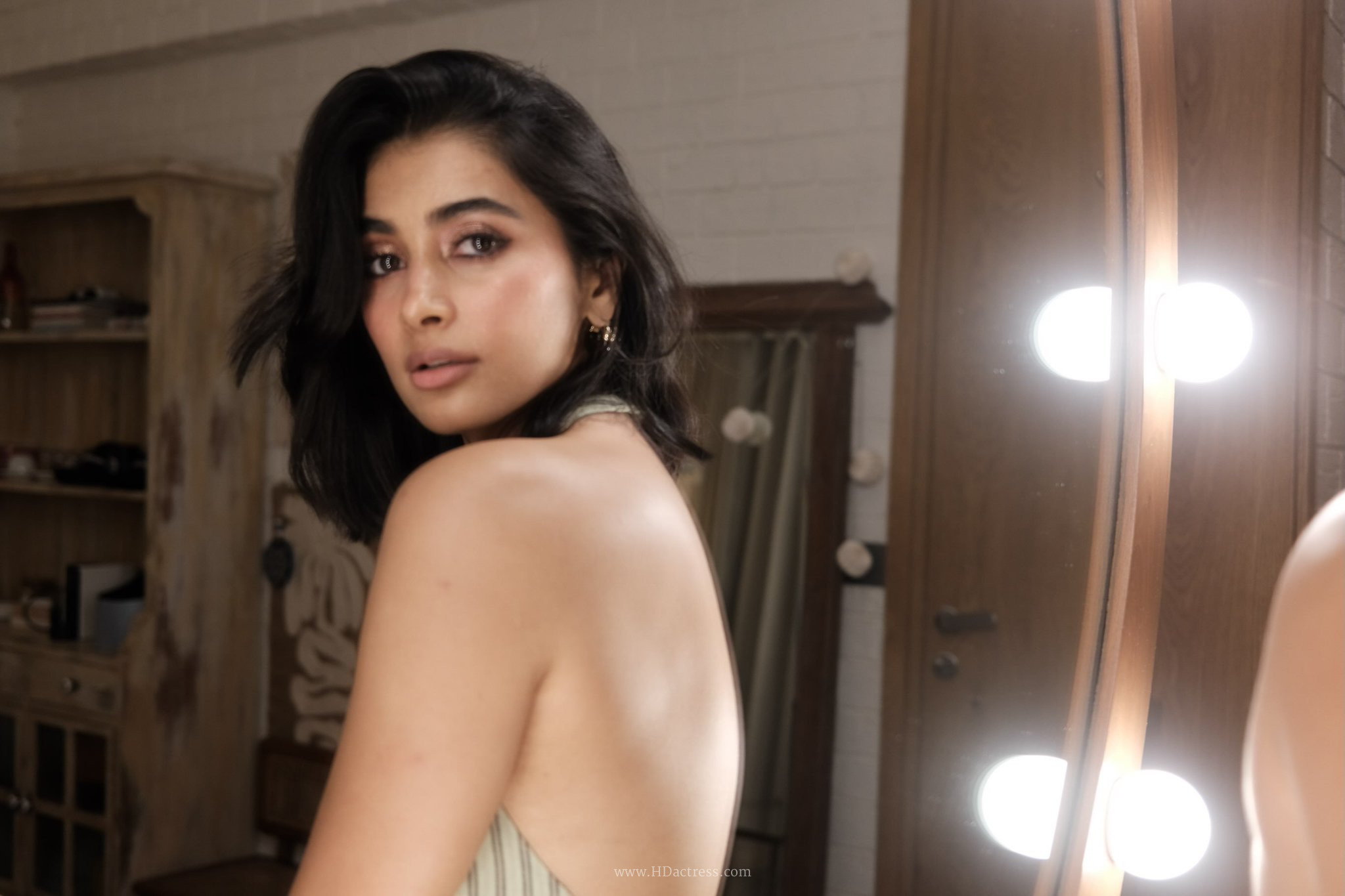 Pooja Hegde flaunting her smooth back in a glamorous blue full backless dress for a viral photoshoot.