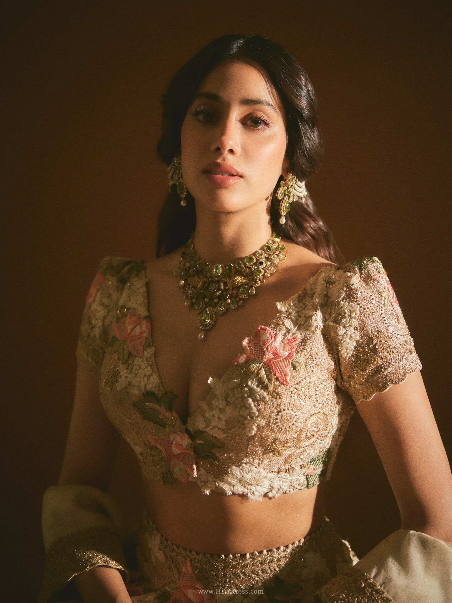 Janhvi Kapoor wearing a sultry deep V-neckline dress posing confidently for viral photoshoot.