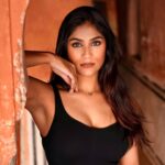 Chiranshi Mathur in black crop top and trousers