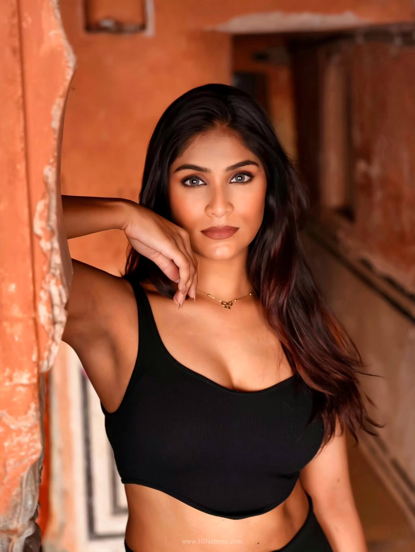 Chiranshi Mathur in black crop top and trousers