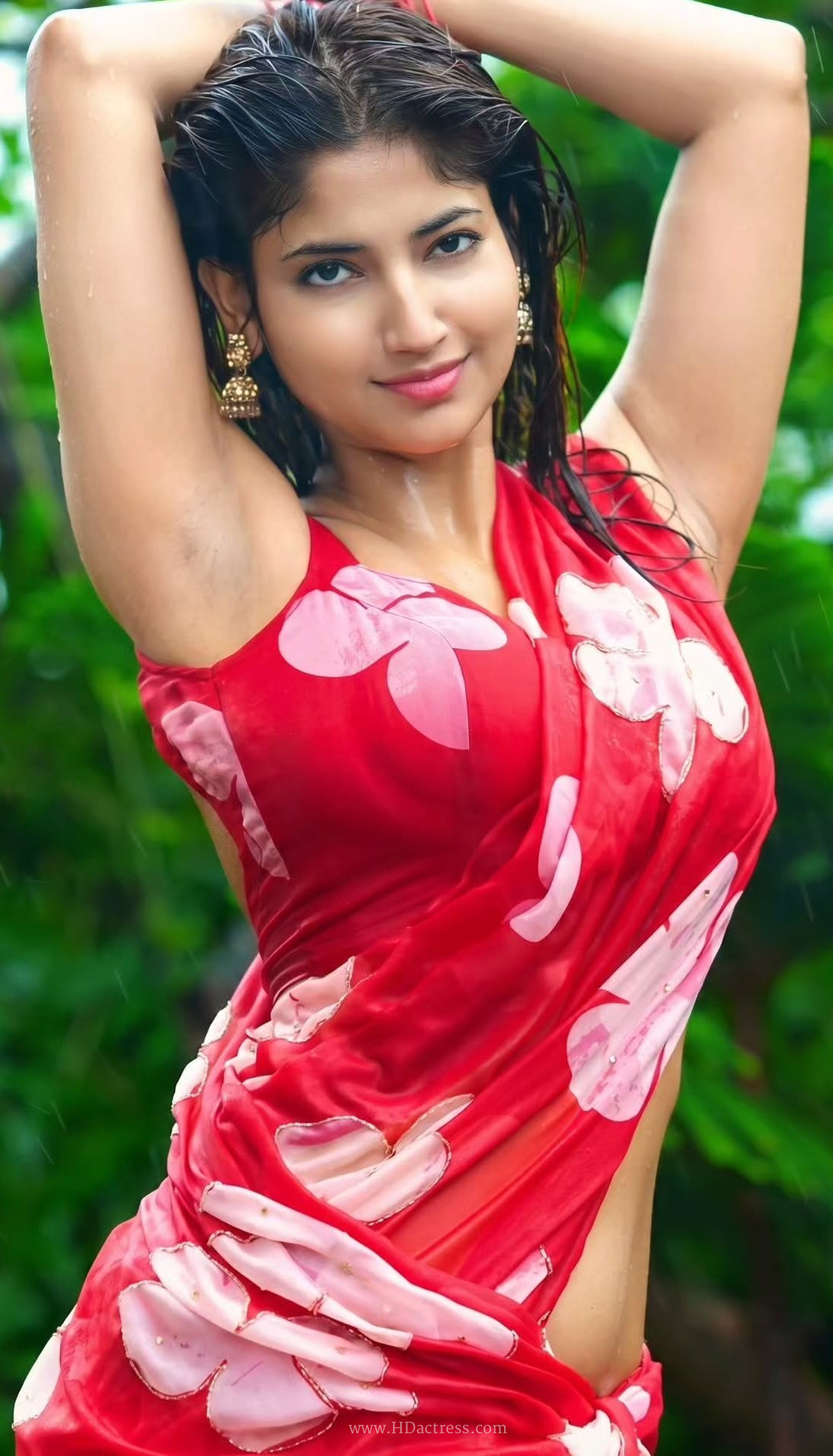 Angel Rai in vibrant red floral saree