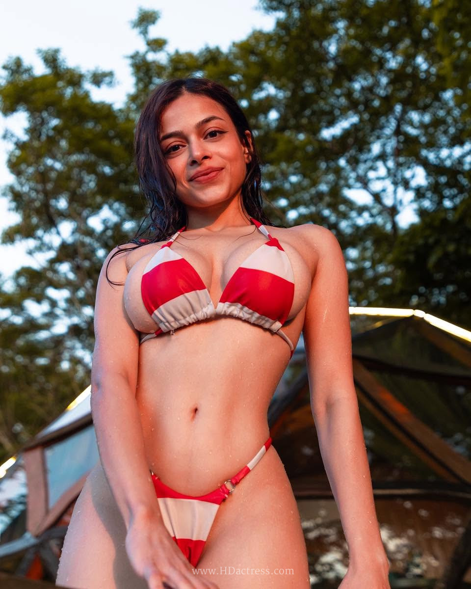 Ash S in red and white striped beachwear