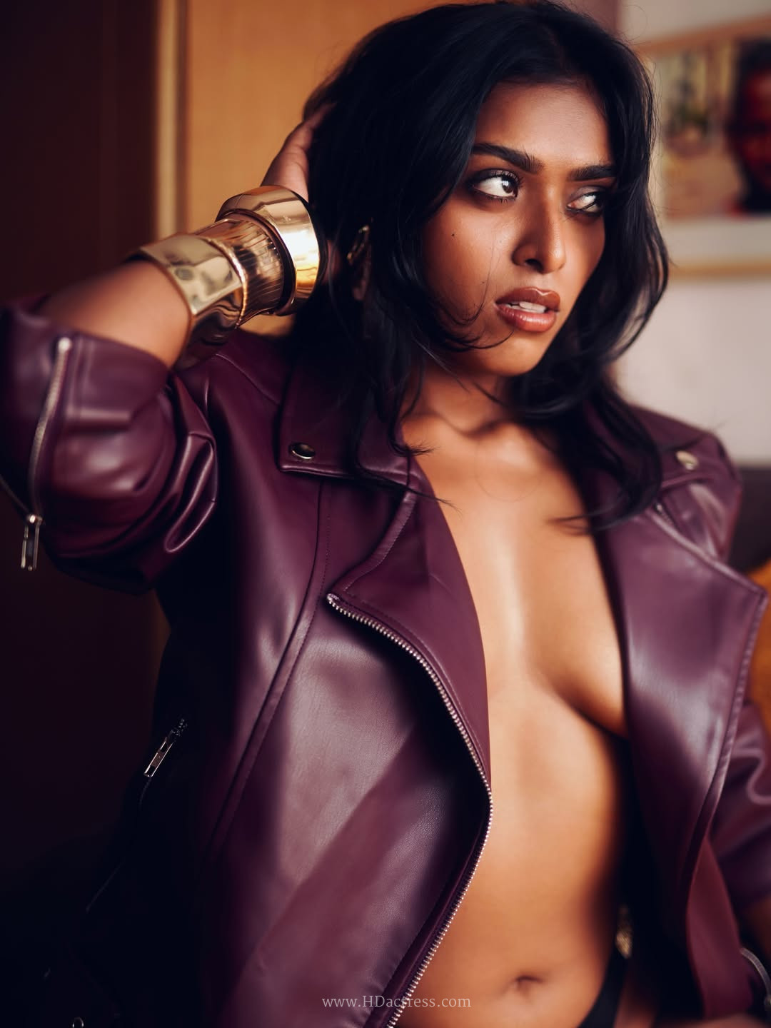 Priyanka Roy in deep plum leather biker jacket