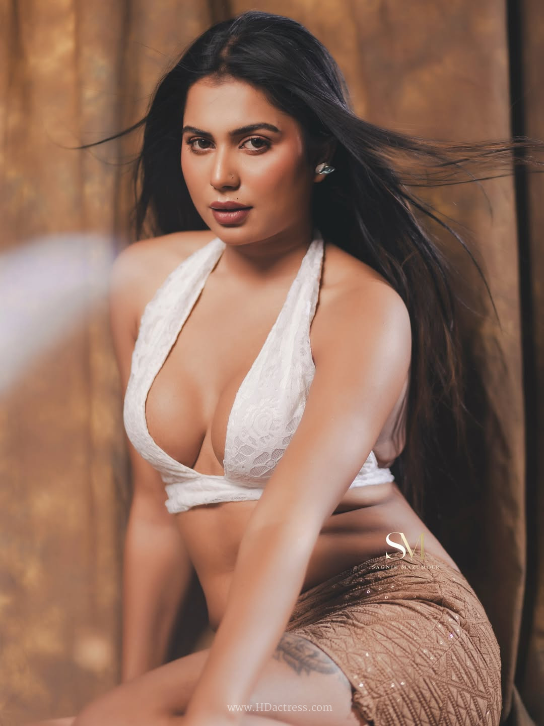 SristiPriya Das in white halter top and taupe skirt