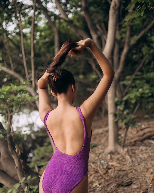 Nikita Khandagale in purple one piece swimsuit