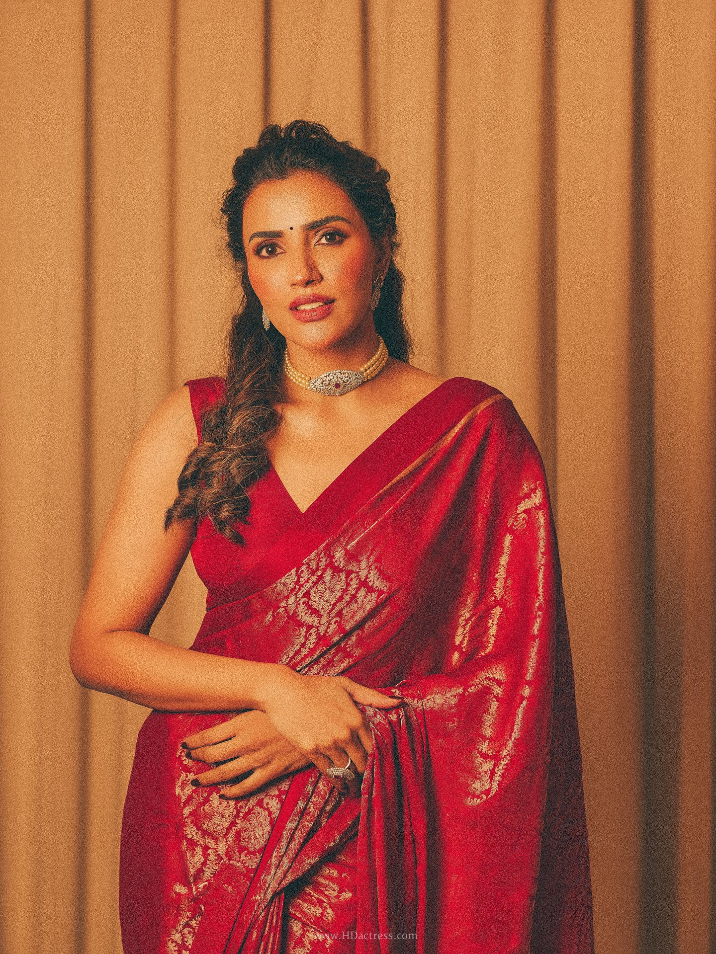 Akshara Gowda in crimson red Banarasi silk saree
