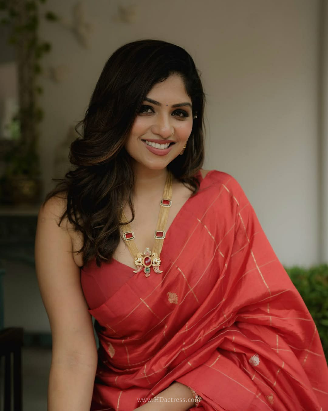 Meenakshi Chaudhary in coral pink Chanderi silk saree