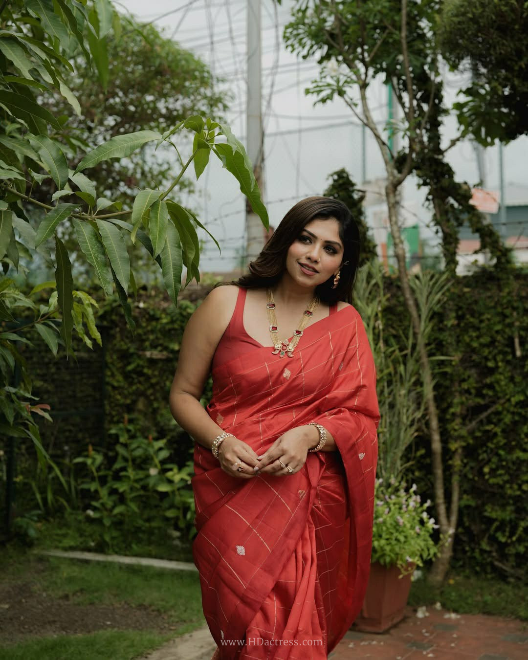 Meenakshi Chaudhary in coral pink Chanderi silk saree Meenakshi Chaudhary in coral pink Chanderi silk saree