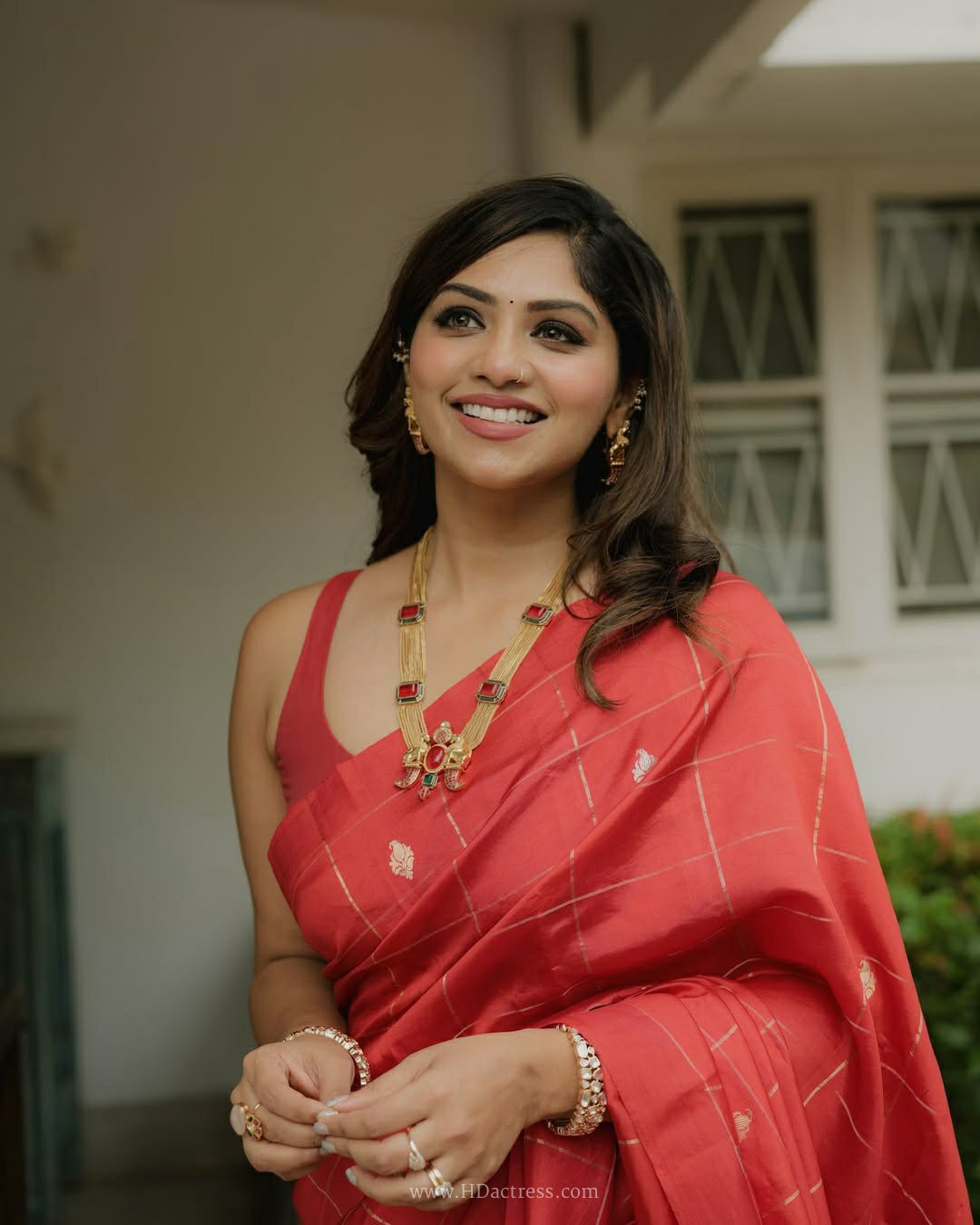 Meenakshi Chaudhary in coral pink Chanderi silk saree Meenakshi Chaudhary in coral pink Chanderi silk saree