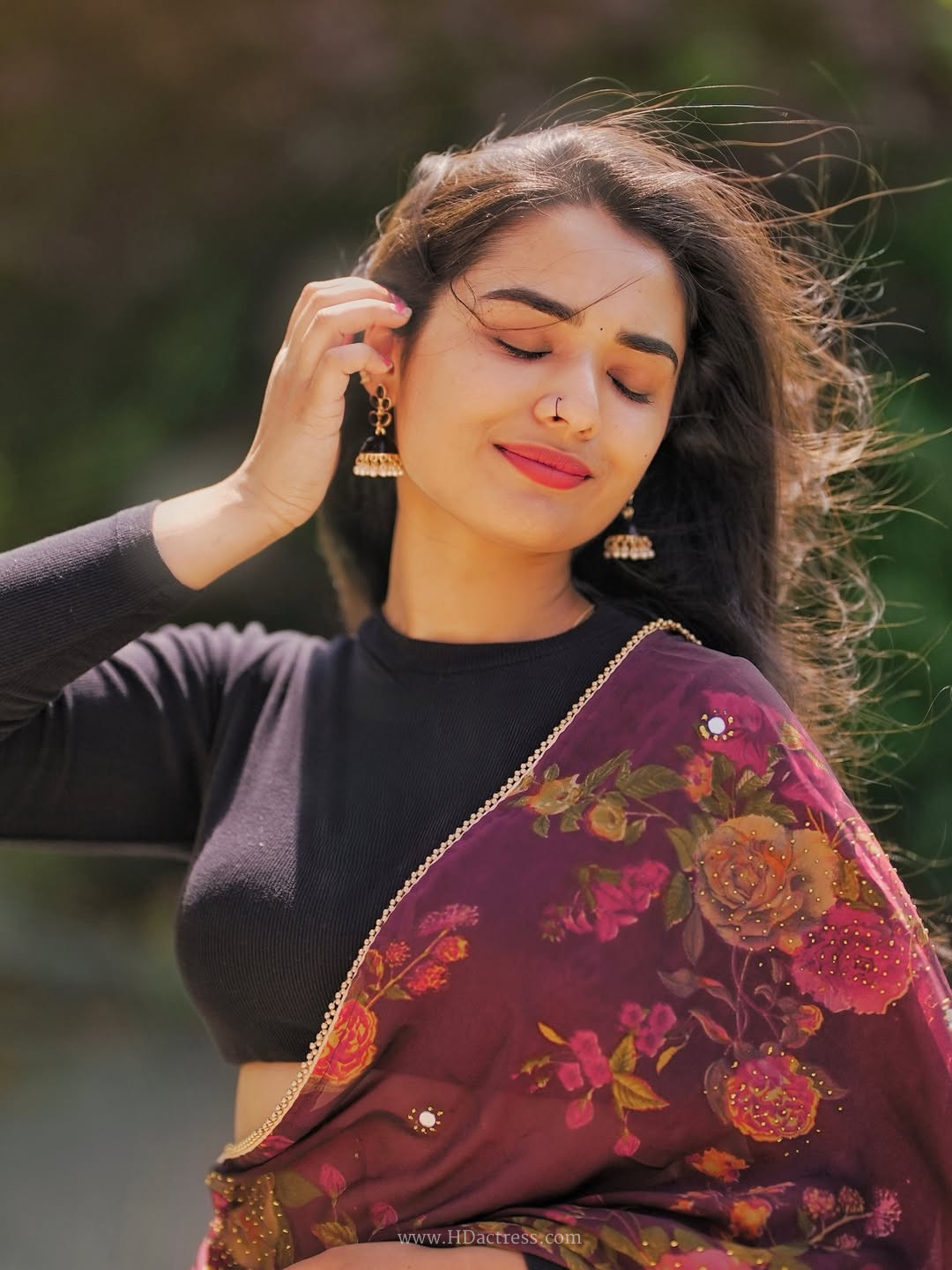 Meenu Pradeep in wine floral saree