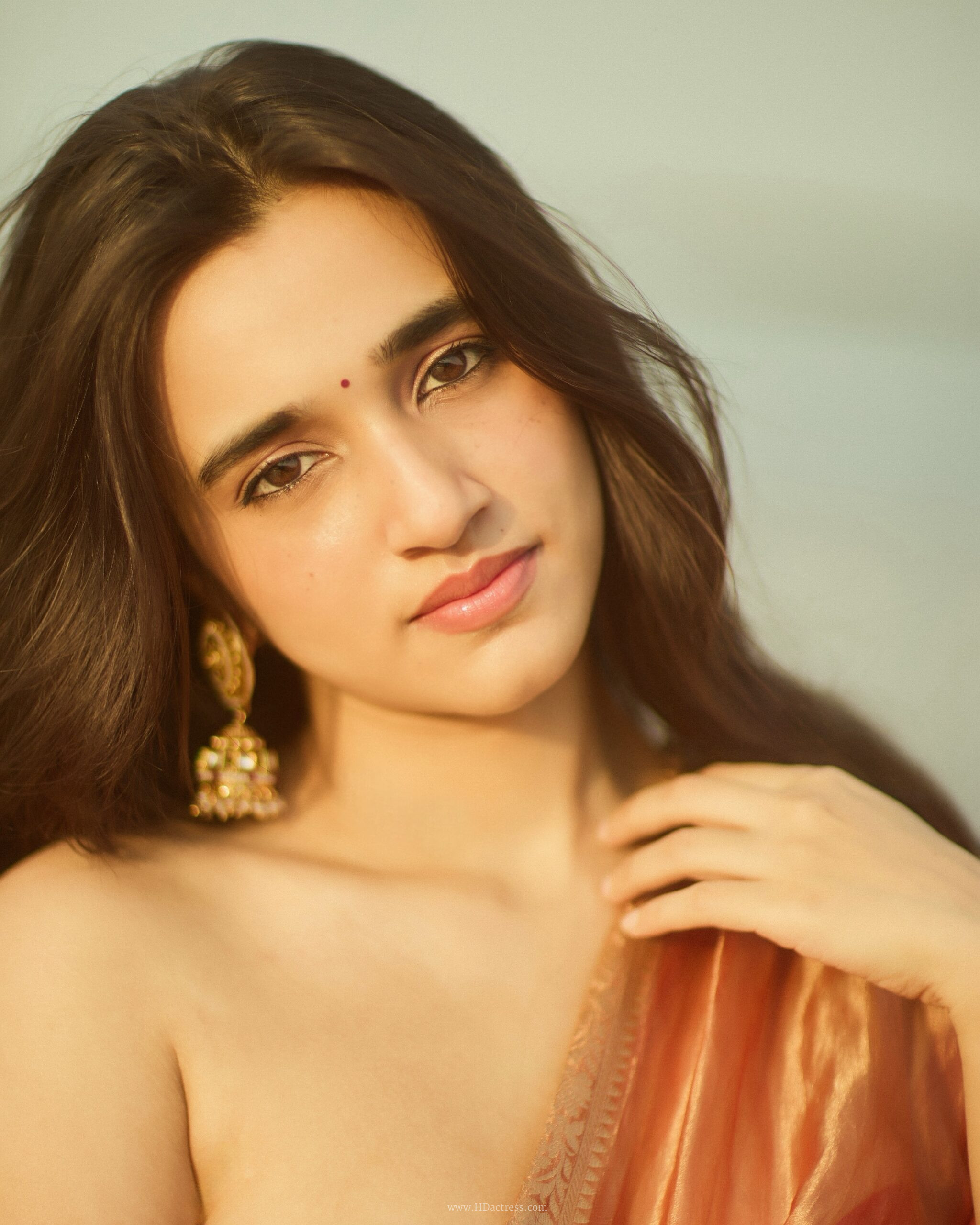 Nuveksha in orange silk saree with gold border Nuveksha in orange silk saree with gold border