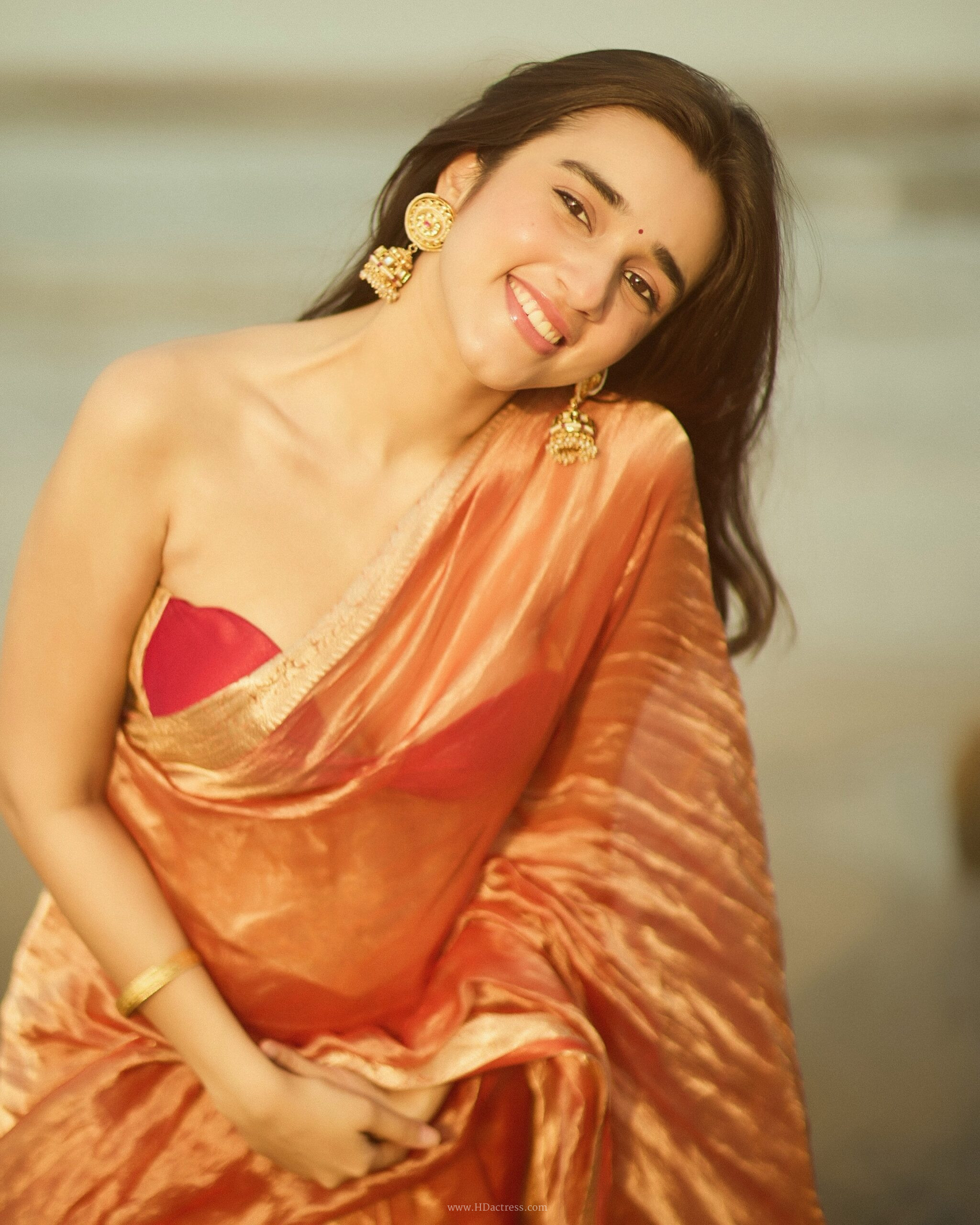 Nuveksha in orange silk saree with gold border Nuveksha in orange silk saree with gold border