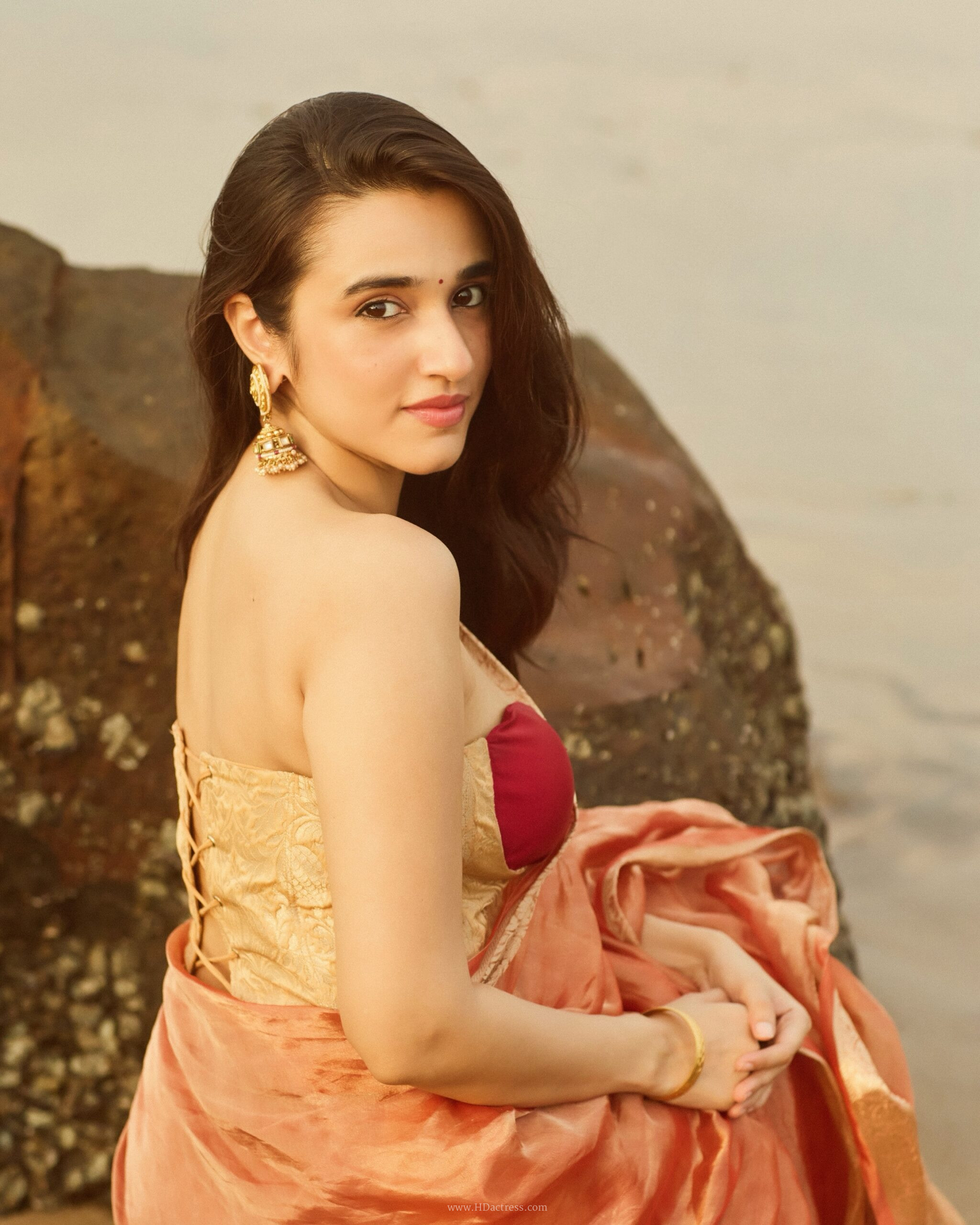 Nuveksha in orange silk saree with gold border Nuveksha in orange silk saree with gold border
