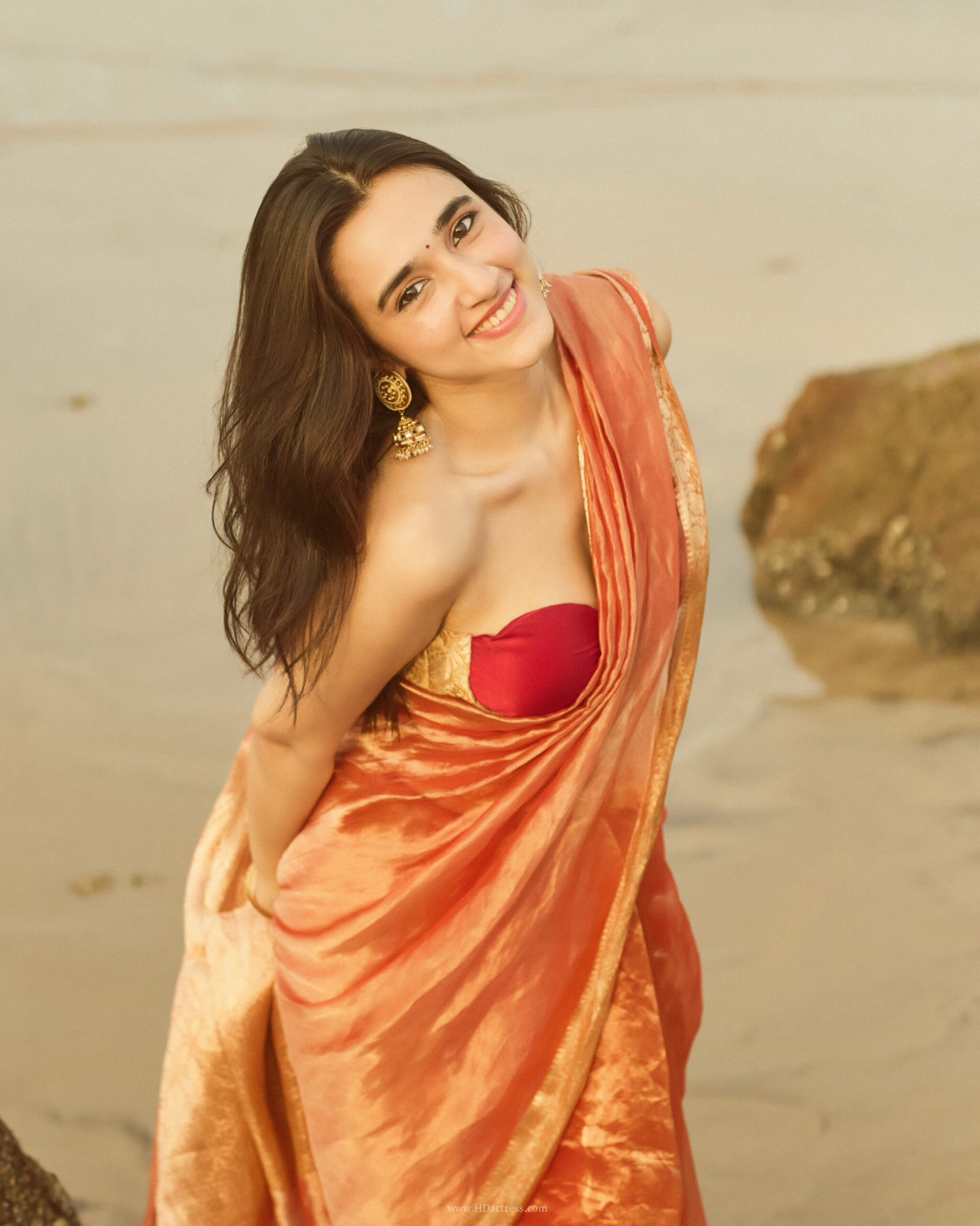Nuveksha in orange silk saree with gold border Nuveksha in orange silk saree with gold border