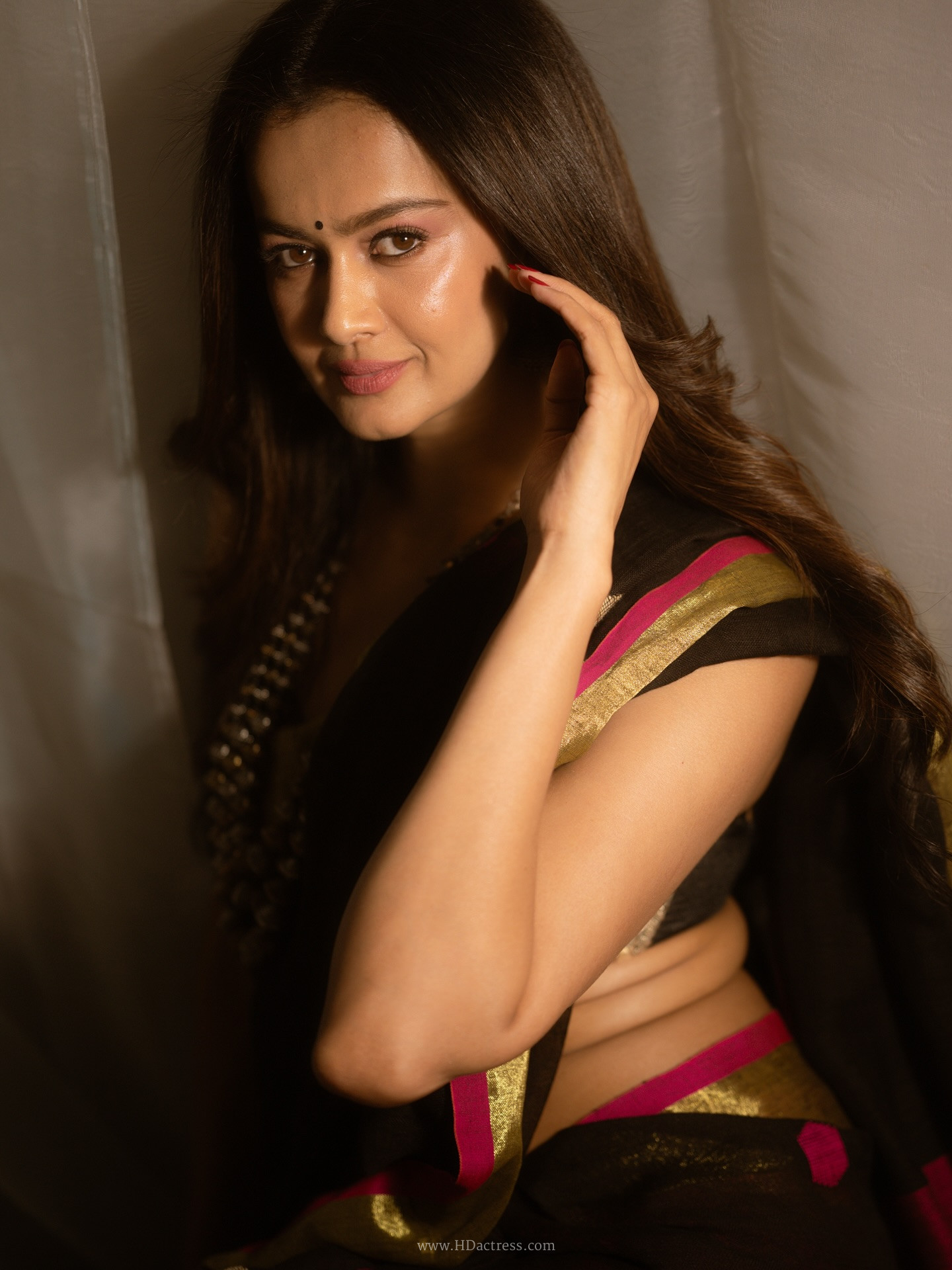 Shubra Aiyappa in black saree with pink zari border