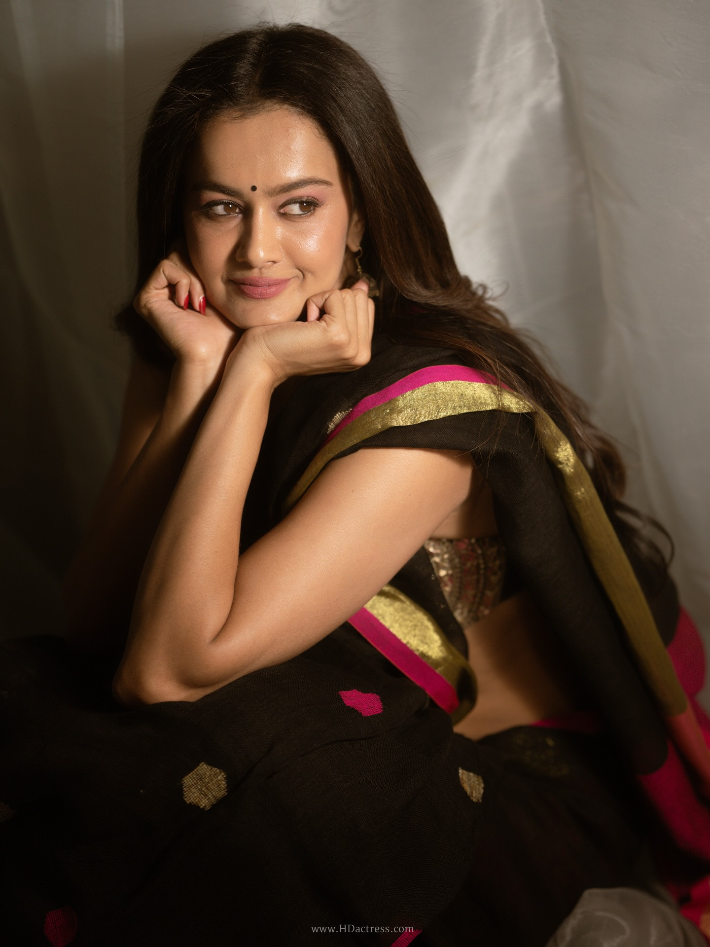 Shubra Aiyappa in black saree with pink zari border Shubra Aiyappa in black saree with pink zari border