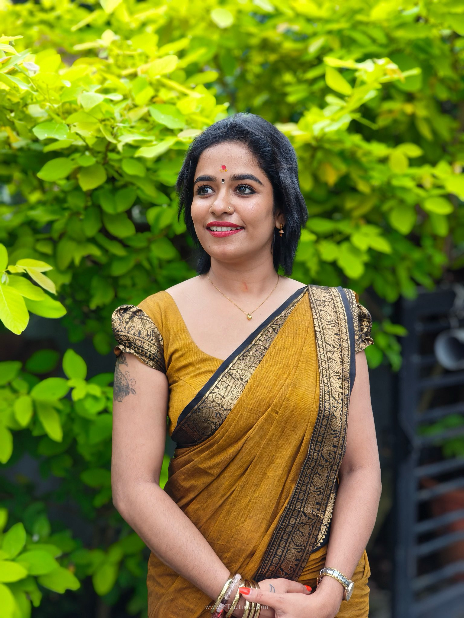 Sreelakshmi Sharangadharan in mustard cotton saree