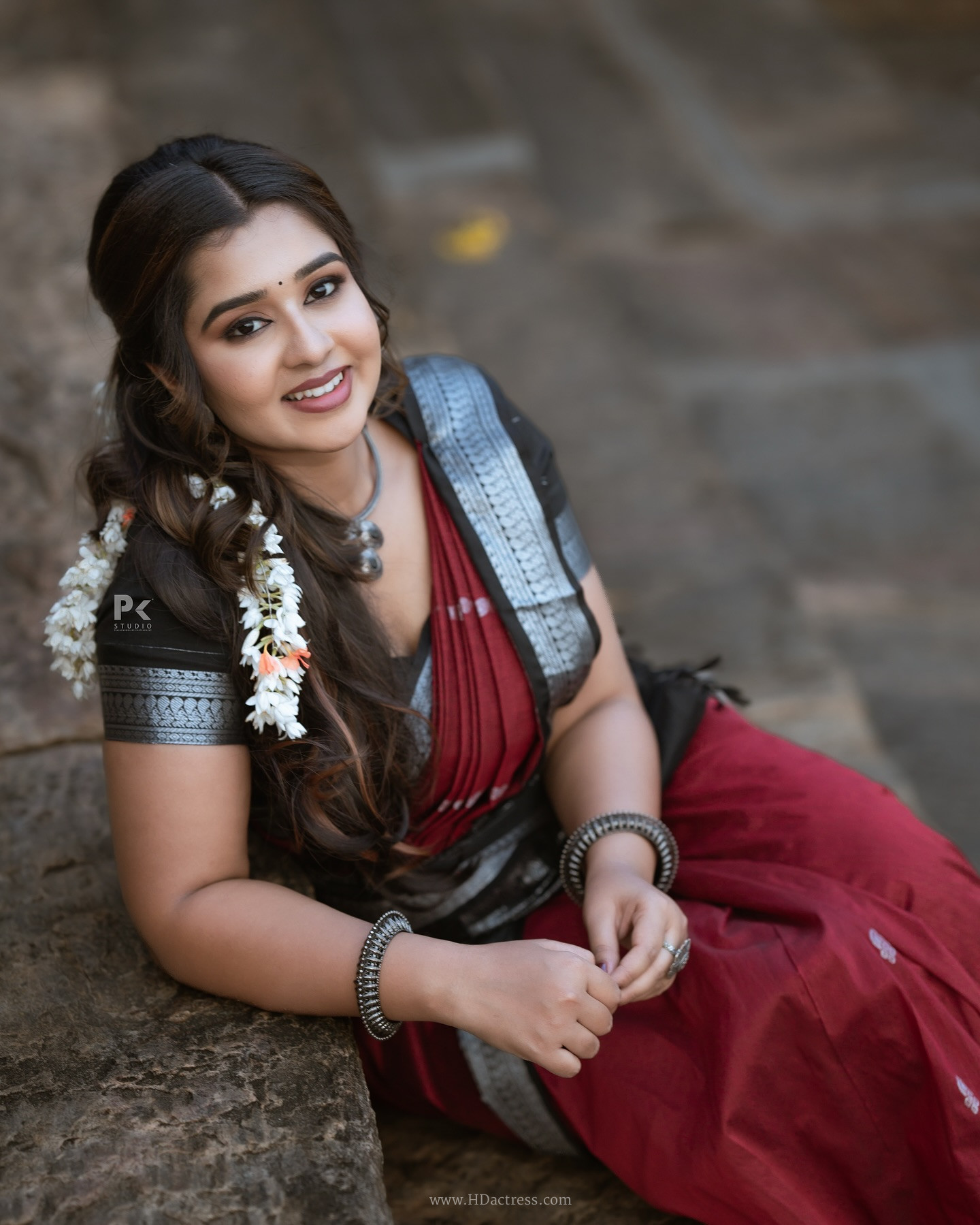 Mouna Guddemane in maroon saree