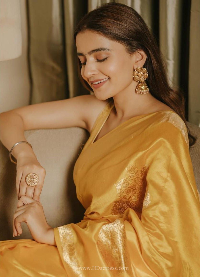 Rukshar Dhillon in mustard yellow Banarasi saree