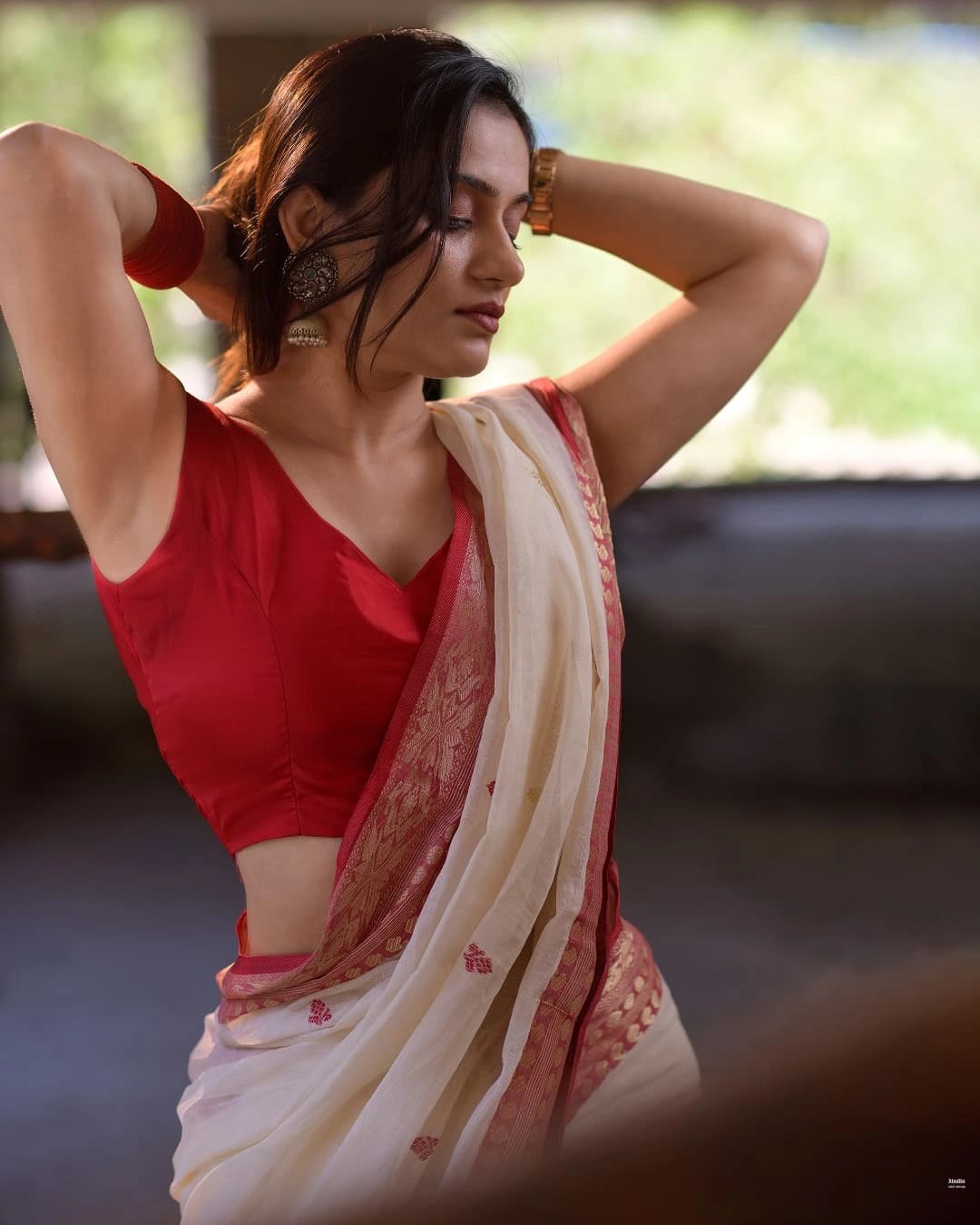 Sudha Rani Naik in off white saree