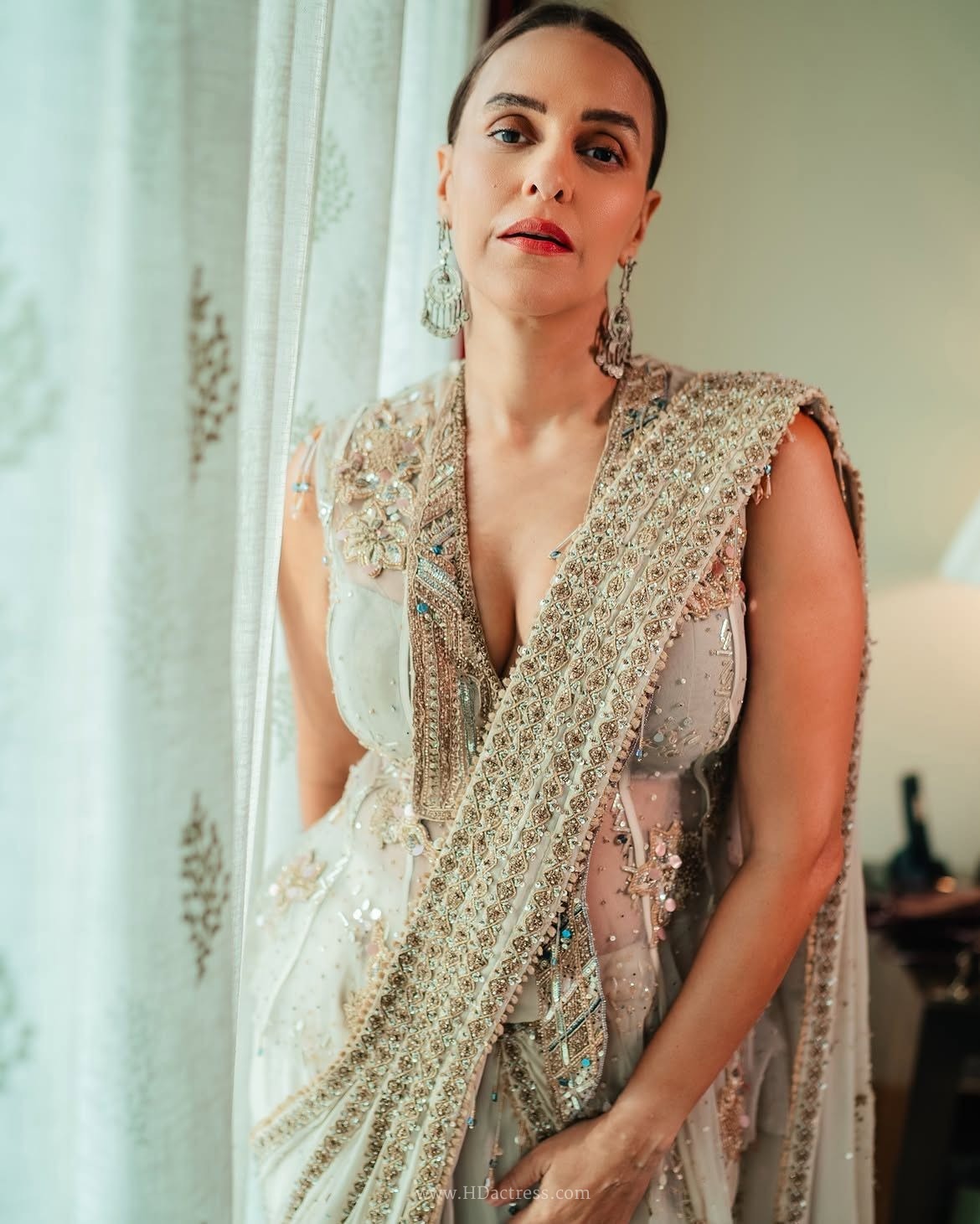 Neha Dhupia, Neha Dhupia viral photos, deep plunge dress, Bollywood fashion, celebrity style guide, Neha Dhupia outfit breakdown, glamour photography, bold fashion trends