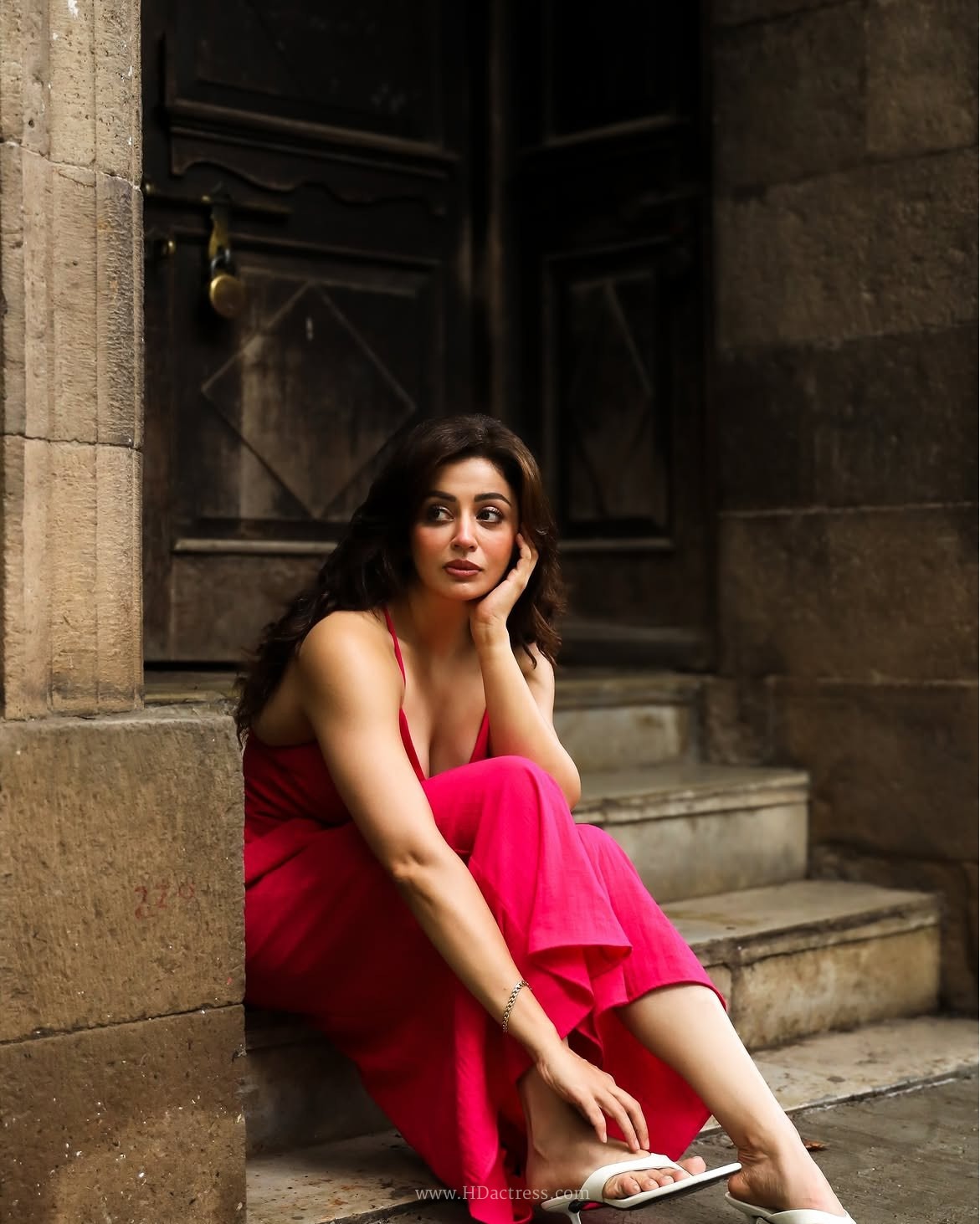 Neha Pendse lights up the feed in a hot pink slip dress that hugs every curve. Explore her bold style statement and fashion details here.