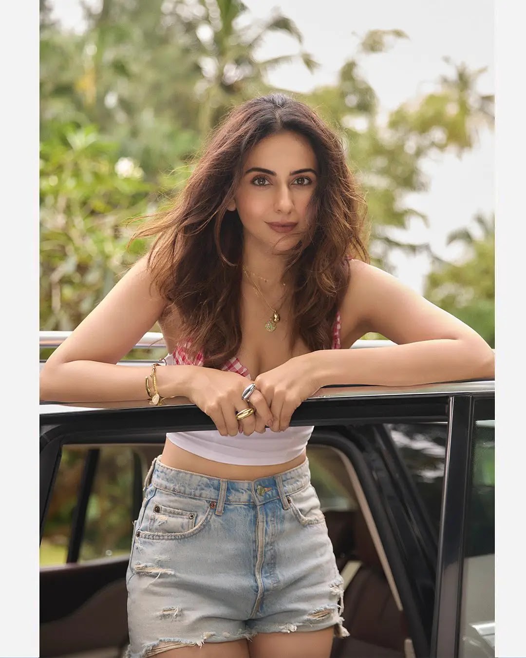 Rakul Preet Singh Long Hair White Top Blue Short - Image 1