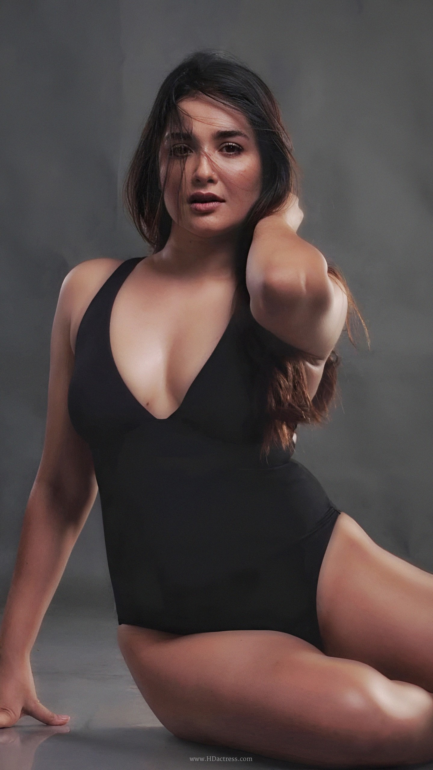 Roshni Bhattacharyya in black one-piece swimsuit