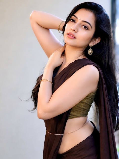 Genzera in dark purple saree and olive green blouse