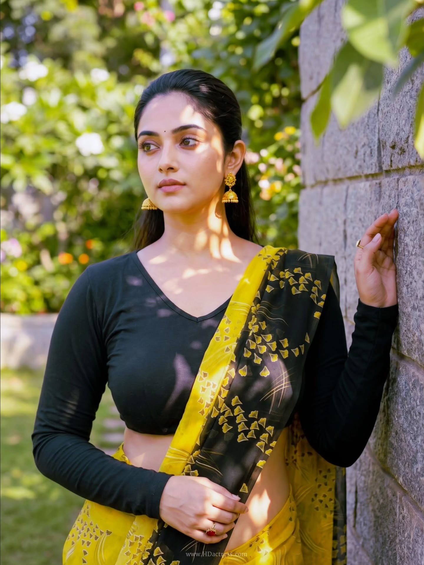 Zayana Vaani in yellow printed saree and black blouse